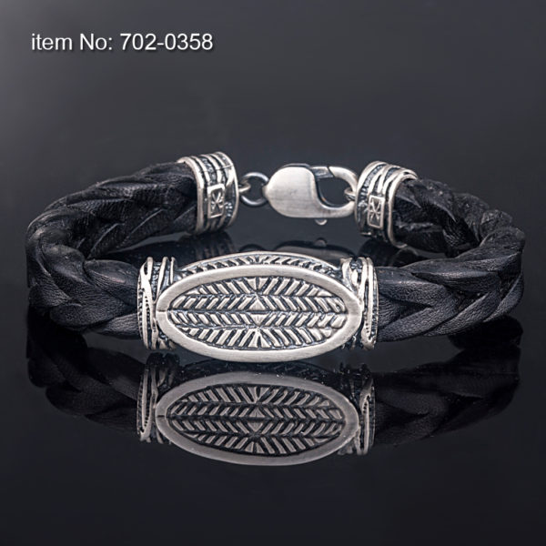 Hand crafted sterling silver bracelet with motif (12 mm). Genuine braided leather