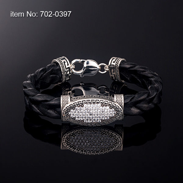 Sterling silver bracelet with white zirgon stones set in motif 12 mm. Genuine braided leather