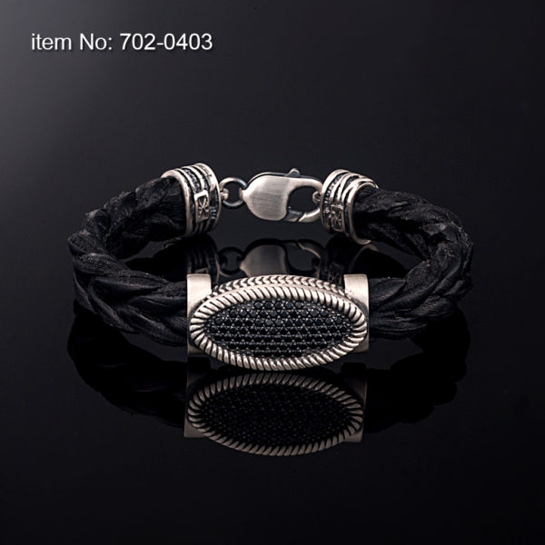 Sterling silver bracelet with black zirgon stones set in motif 12 mm. Genuine braided leather