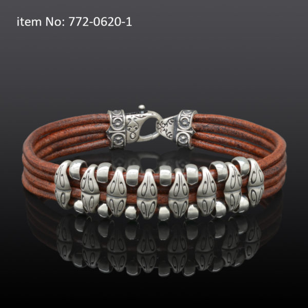Sterling silver bracelet with motif washers and braided brown quadruple leather