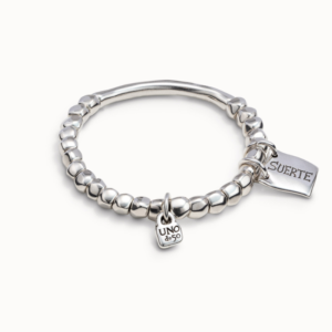 Beaded bracelet with silver-plated metal tube shaped piece and charm with a message of “fortune.”