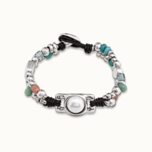 Bracelet made from two layers of brown leather with numerous silver-plated metal beads and colored artisan crystals. The central feature of this bracelet is a rectangular piece set with a pearl.
