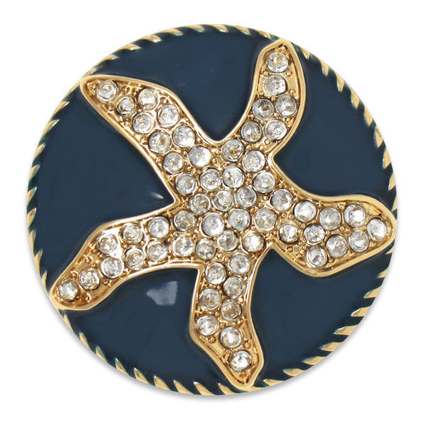 The Mia snap is a navy enamel domed snap adorned with a starfish shape made out of crystals.
